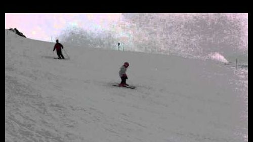 Molly Skiing to the orange pole followed by Daddy 6th day of skiing